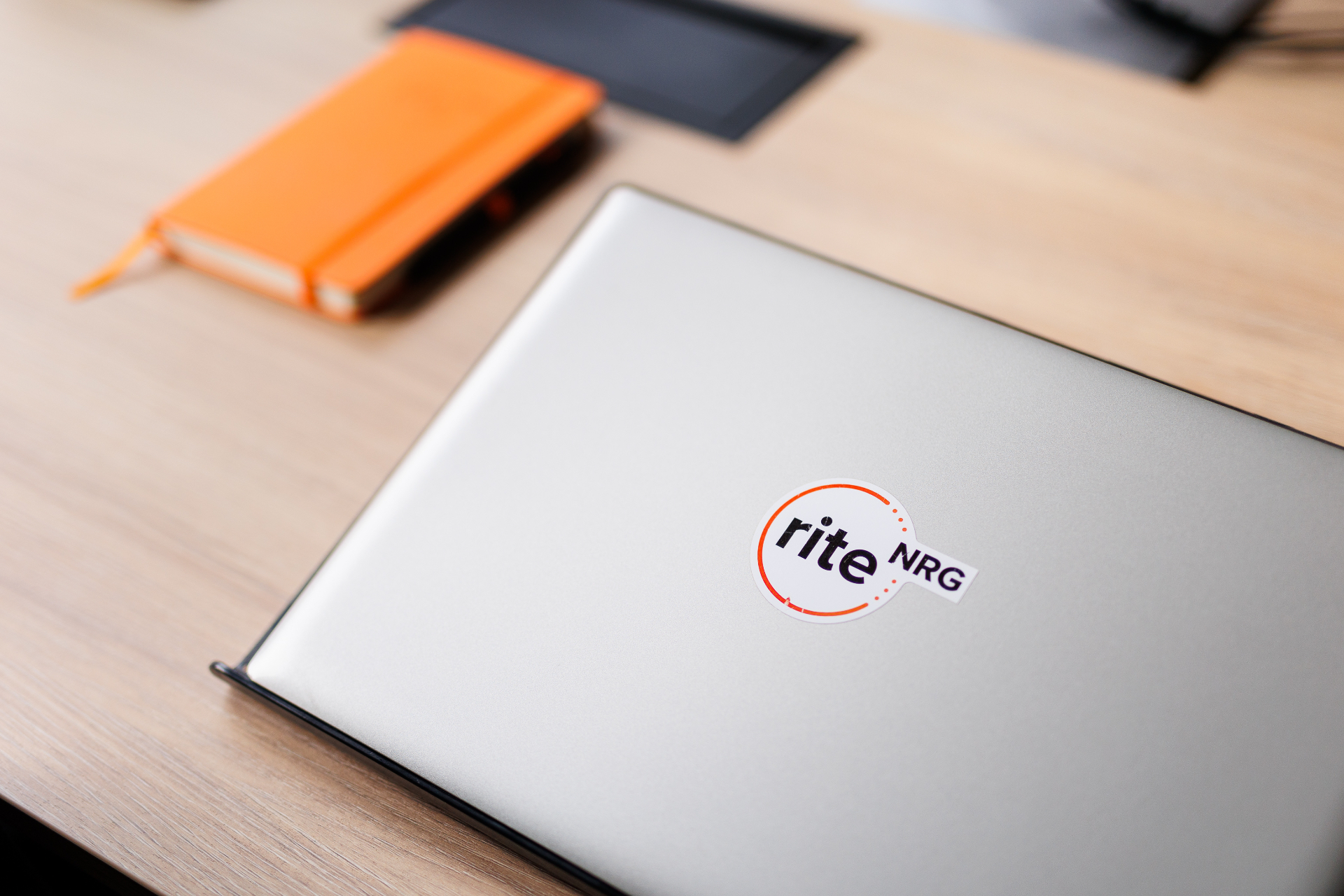 A RITE NRG sticker on an engineer's laptop